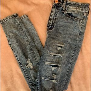 Ripped jeans holes are covered.